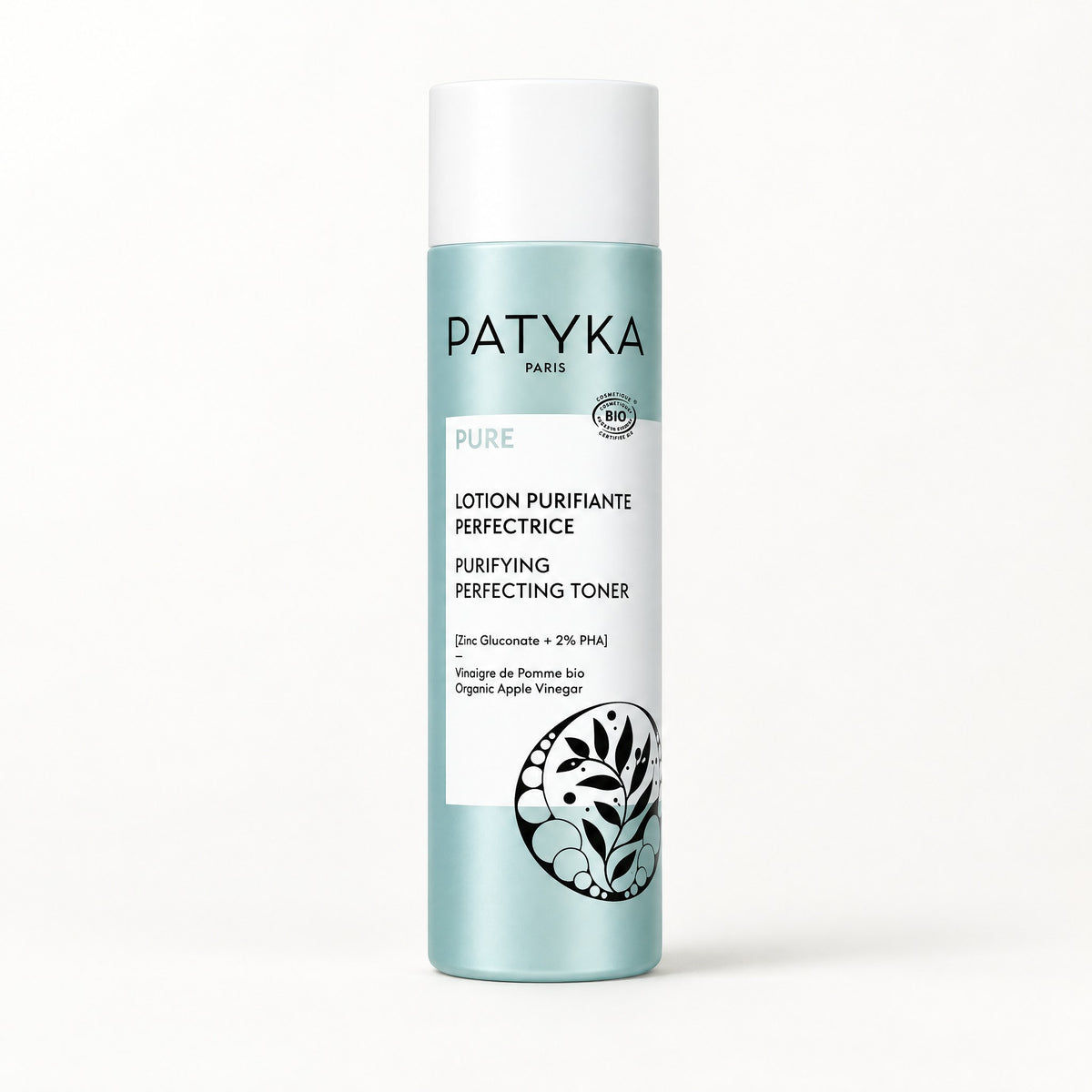Botella verde azulado con tapa blanca y emblema de hojas, Patyka Pure Lotion Purifiante Perfectrice