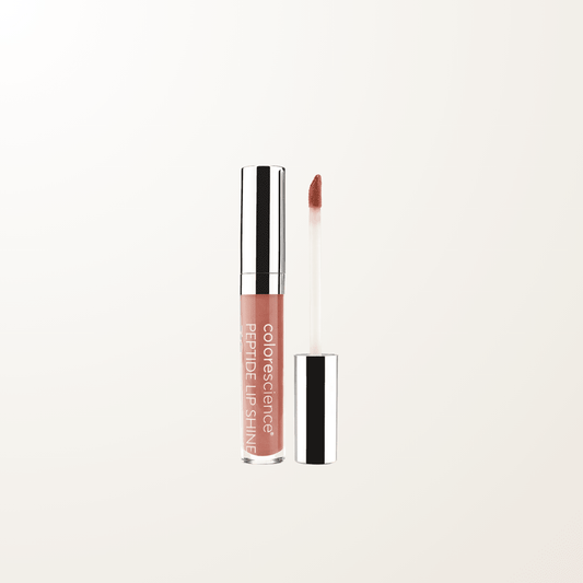 Brillo labial mineral Colorescience tono Champagne con protección SPF 30 y acabado luminoso.