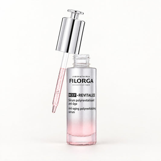 Frasco con gotero de Filorga NCEF-Revitalize, sérum polirrevitalizante antiedad plateado y rosa