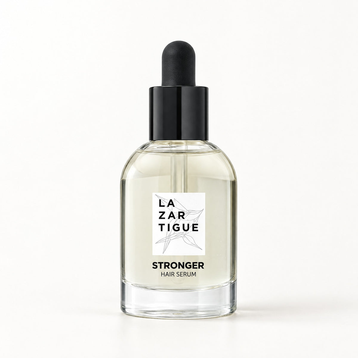 Frasco de vidrio transparente con gotero negro y etiqueta blanca, Stronger Hair Serum 50 ml La Zartigue