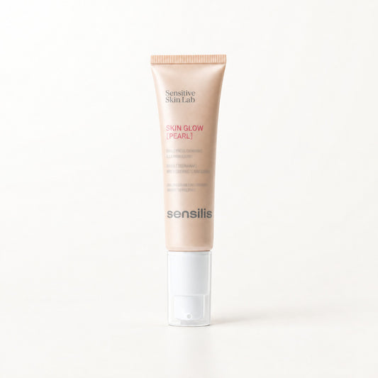 Tubo color durazno con base blanca y texto rosa, Sensilis Skin Glow Pearl iluminador